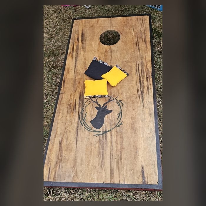 Custom cornhole board with a deer design