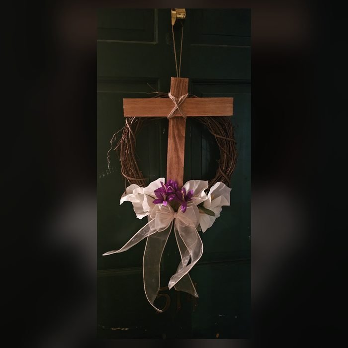 Handmade cross-shaped floral wreath